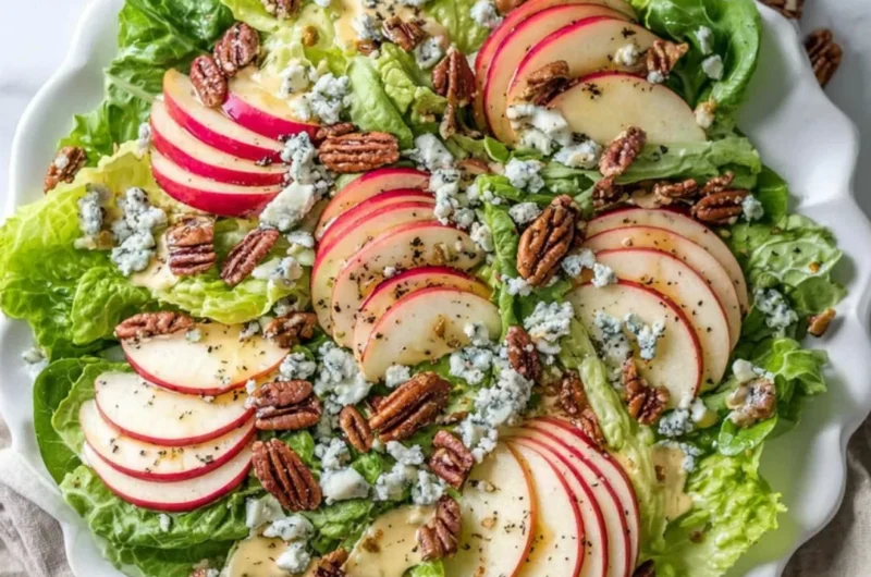 Fresh Apple Pecan Salad with Blue Cheese dressing and topped with pecans.