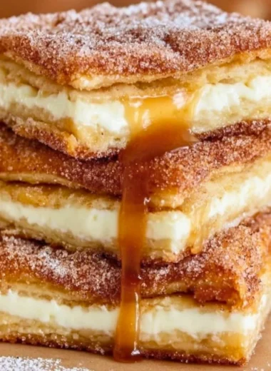 Delicious Churro Cheesecake with a cinnamon topping and whipped cream