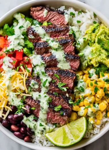 A vibrant cilantro lime steak bowl featuring grilled steak, rice, and fresh vegetables.