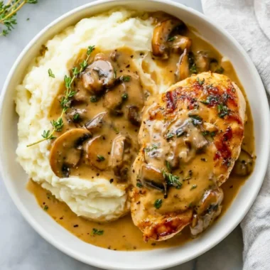 Creamy Mushroom Chicken dish garnished with herbs