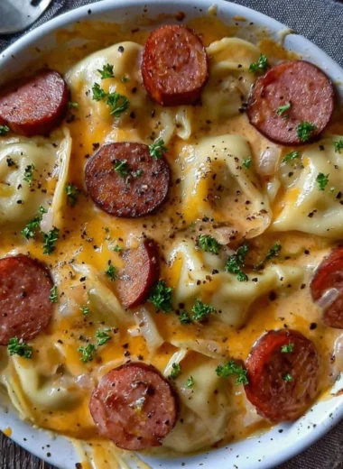 Crockpot pierogi casserole with kielbasa served in a bowl.