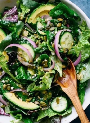 Colorful and fresh everyday salad recipe with various vegetables and toppings.