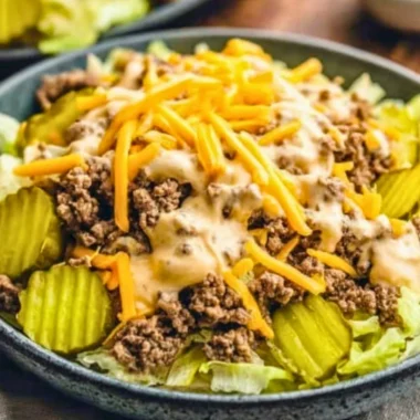 Keto Big Mac Salad topped with lettuce, cheese, and special sauce