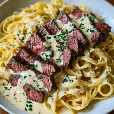 Savory Steak Gorgonzola Alfredo with Creamy Parmesan Sauce served on a plate