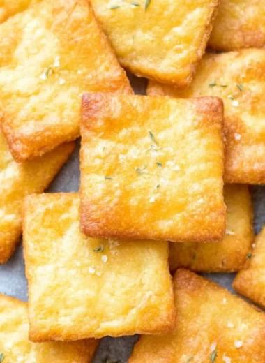 Homemade 2 ingredient keto crackers on a wooden board