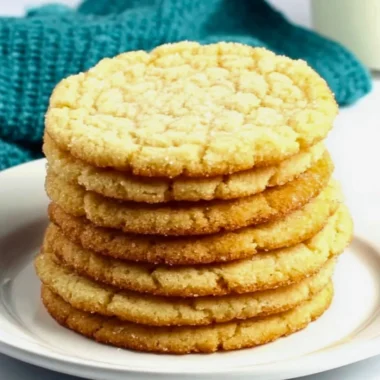 Delicious sugar cookies on a decorative plate, showcasing their perfect texture.