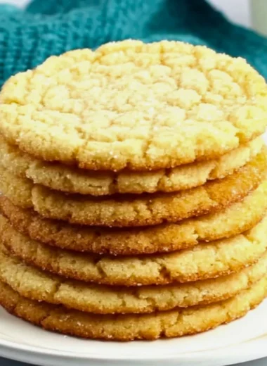 Delicious sugar cookies on a decorative plate, showcasing their perfect texture.