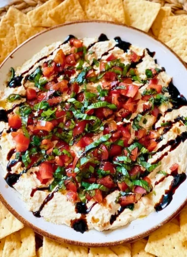 A bowl of delicious Bruschetta Dip with fresh tomatoes and herbs.