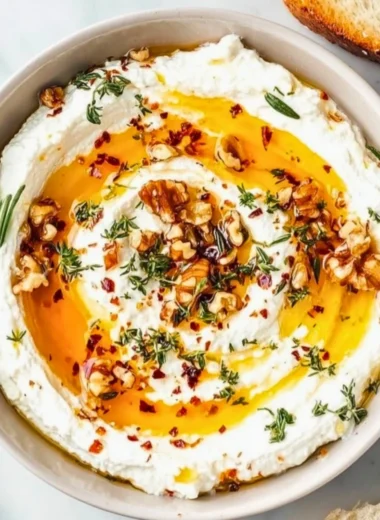 Delicious ricotta dip drizzled with hot honey served in a bowl