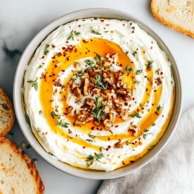 Delicious ricotta dip topped with hot honey in a serving bowl