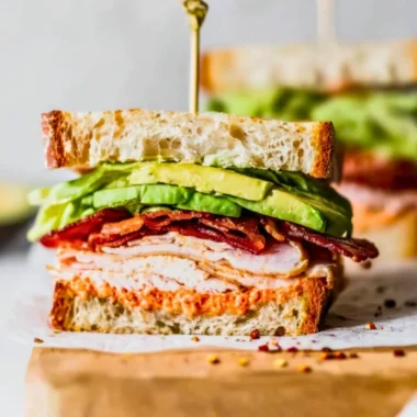 Delicious easy turkey club sandwich with bacon and vegetables