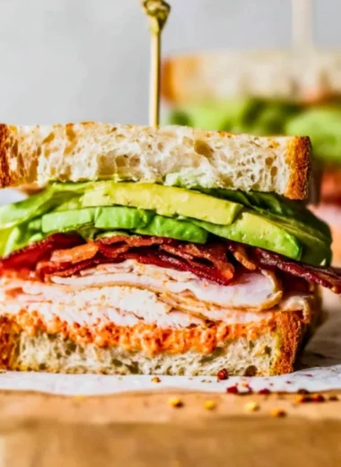 Delicious easy turkey club sandwich with bacon and vegetables