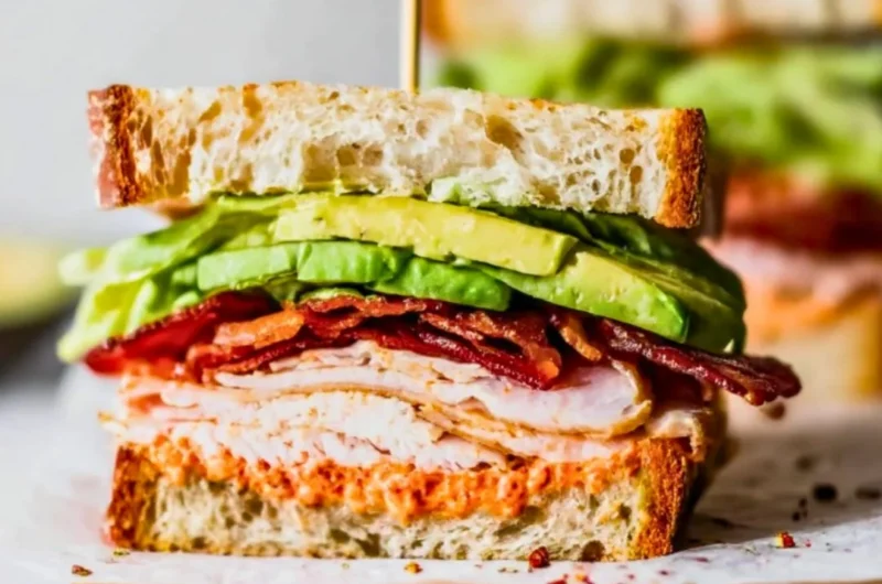 Delicious easy turkey club sandwich with bacon and vegetables