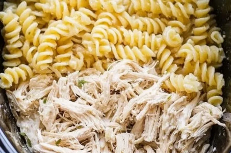 Plate of Garlic Parmesan Chicken Pasta garnished with parsley