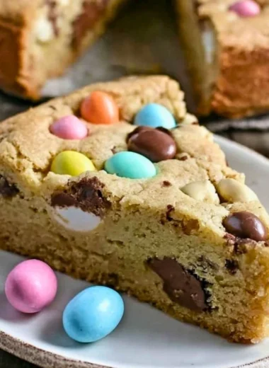 Giant Candy Cookie Pie topped with colorful candies and chocolate chips