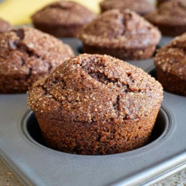 Freshly baked glazed gingerbread muffins with a rich, spiced flavor