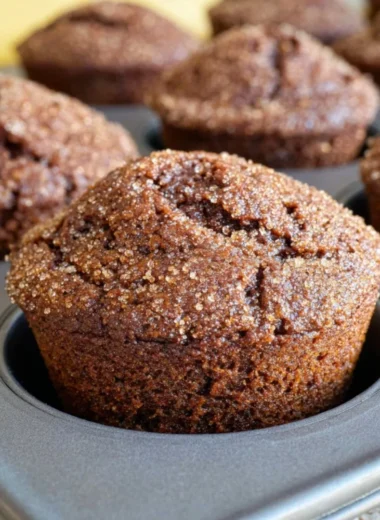Freshly baked glazed gingerbread muffins with a rich, spiced flavor