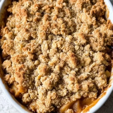 Delicious gluten-free apple crisp dessert topped with oats and nuts