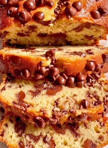 Delicious homemade Greek Yogurt Cake with fresh berries and whipped cream.