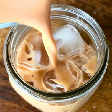 Refreshing Iced English Tea Latte served in a glass with ice and milk.