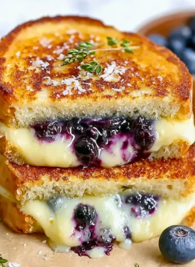 Delicious blueberry grilled cheese sandwich with melted cheese and fresh blueberries