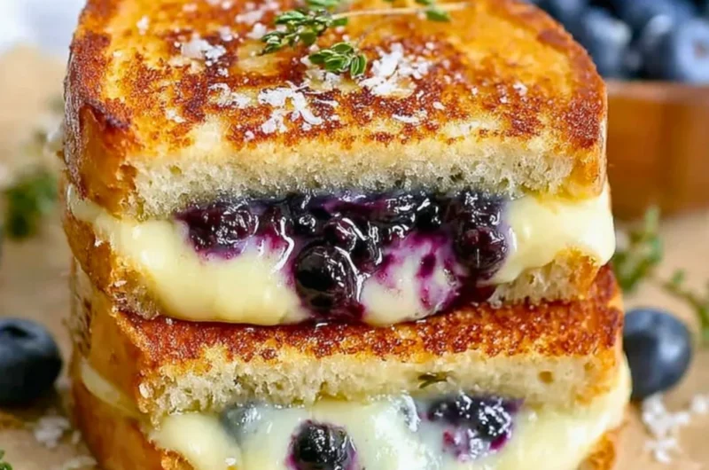 Delicious blueberry grilled cheese sandwich with melted cheese and fresh blueberries