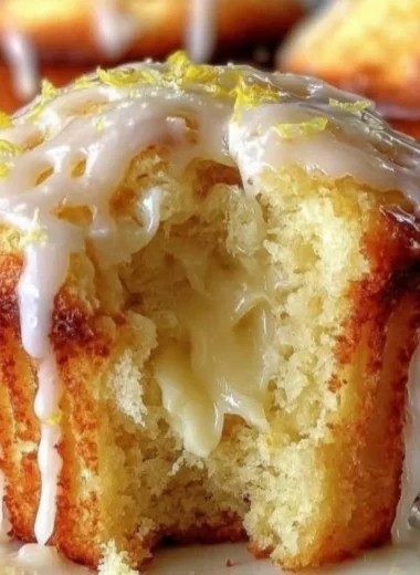 Delicious Lemon Cream Cheese Muffins fresh out of the oven on a cooling rack