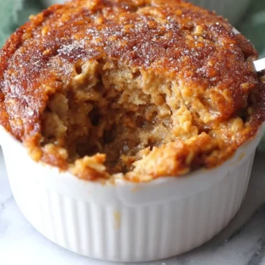 Delicious Oatmeal Muffin Cake topped with nuts and served on a plate