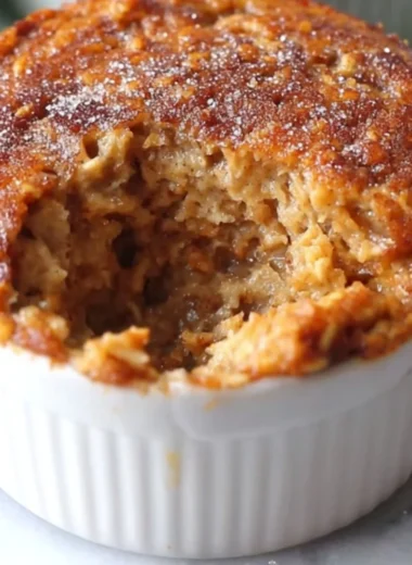 Delicious Oatmeal Muffin Cake topped with nuts and served on a plate