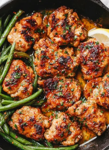 Skillet garlic butter chicken served with green beans, a delicious meal recipe.