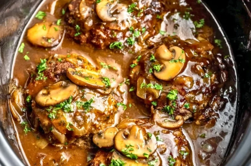 Delicious slow cooker Salisbury steak served with gravy and mashed potatoes