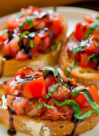 Plate of delicious bruschetta topped with tomatoes and basil