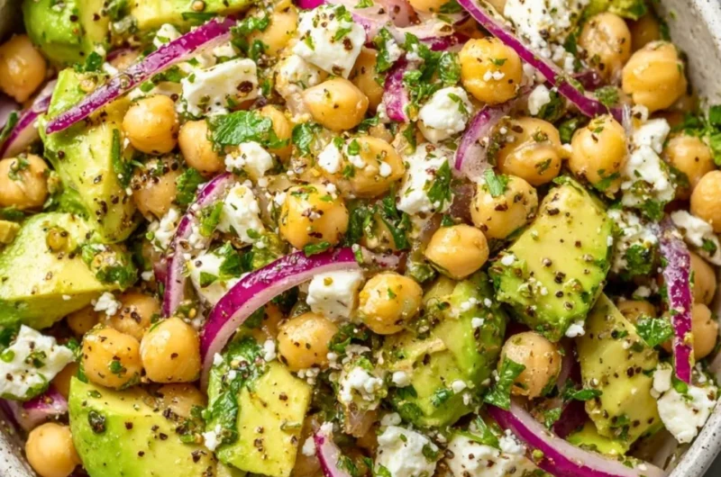 A vibrant Chickpea Feta Avocado Salad with fresh ingredients and colorful presentation.
