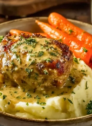 Delicious creamy herb chicken served with mashed potatoes and honey glazed carrots.
