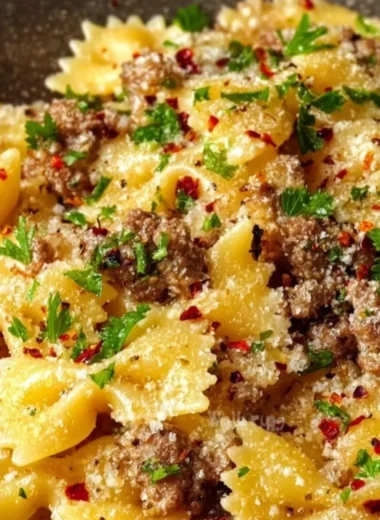 Plate of Garlic Butter Bowtie Pasta with Beef garnished with parsley