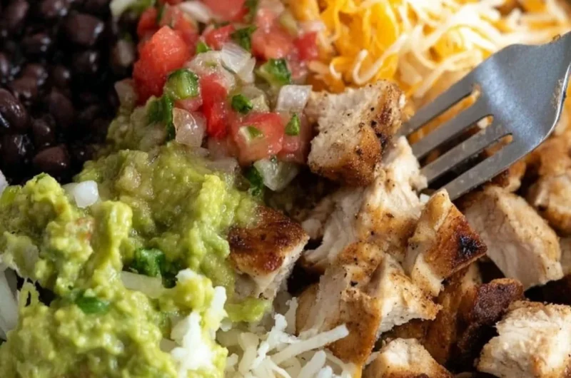 Grilled chicken burrito bowl with rice and beans served in a bowl