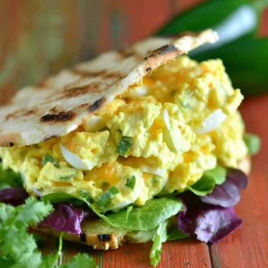 Jalapeno Cheddar Egg Salad served in a bowl with fresh herbs