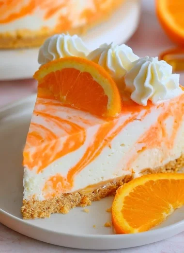 No-bake orange creamsicle cheesecake topped with orange slices