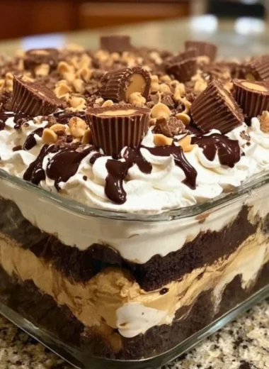 No-bake peanut butter chocolate mousse dessert in a glass topped with chocolate shavings
