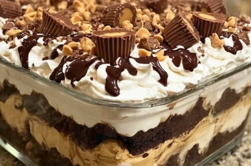 No-bake peanut butter chocolate mousse dessert in a glass topped with chocolate shavings