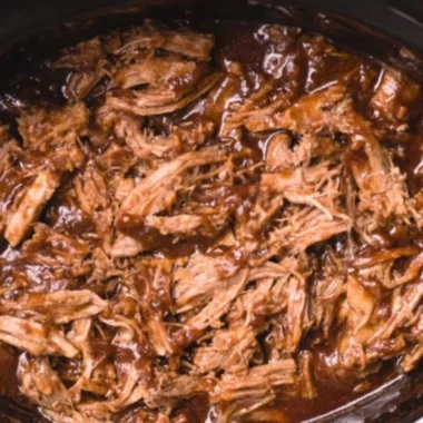 Delicious BBQ pulled pork made in a slow cooker with savory flavors.