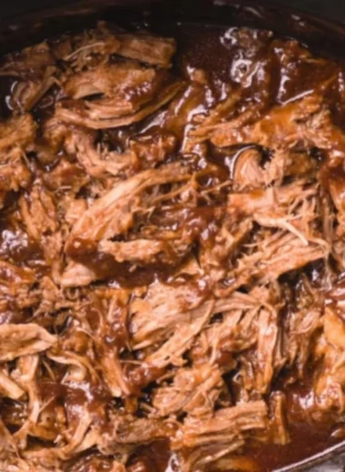 Delicious BBQ pulled pork made in a slow cooker with savory flavors.