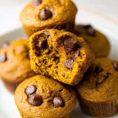 Freshly baked pumpkin protein muffins on a cooling rack