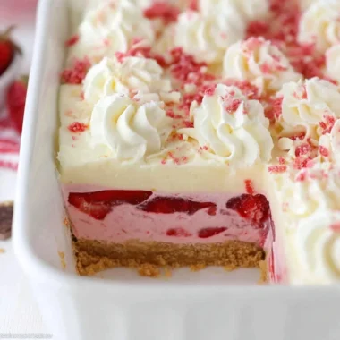 Delicious strawberry delight dessert featuring fresh strawberries and whipped cream.