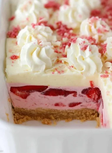 Delicious strawberry delight dessert featuring fresh strawberries and whipped cream.