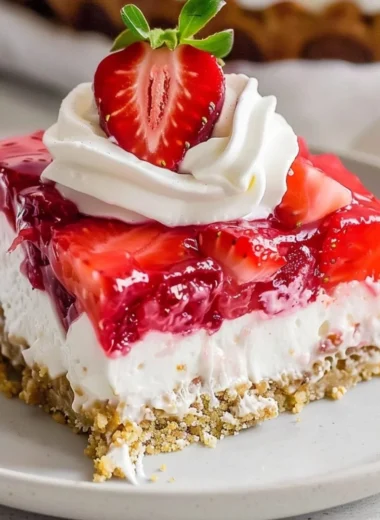 Delicious Strawberry Pretzel Salad with strawberries, pretzel crust, and creamy topping.