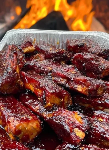 Delicious BBQ ribs served with sides on a rustic table