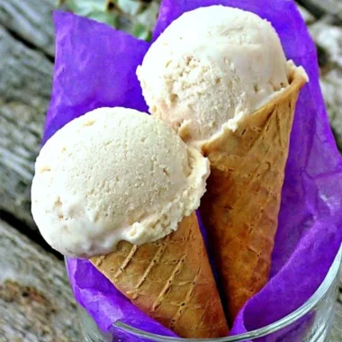 Delicious banana frozen yogurt topped with fresh banana slices and a mint garnish.