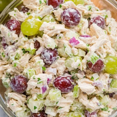 Delicious chicken salad served in a bowl with fresh ingredients and herbs