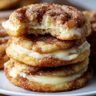Cinnamon Roll Cheesecake Cookies with cream cheese frosting and cinnamon swirl